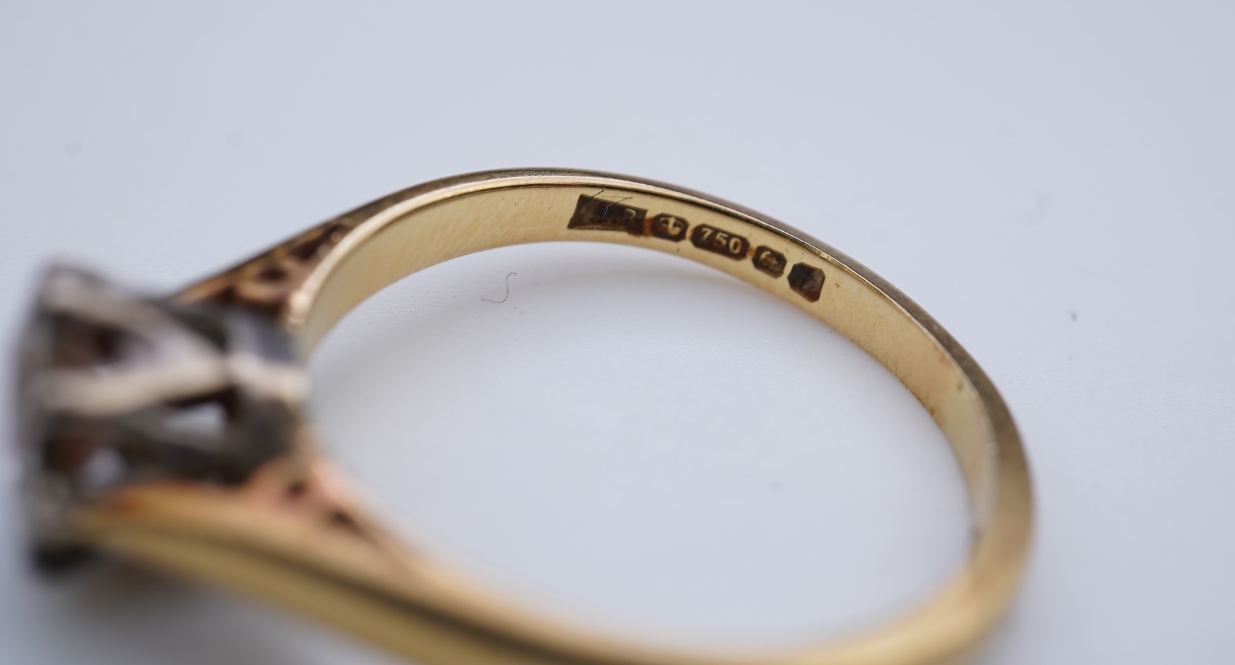 A diamond solitaire ring